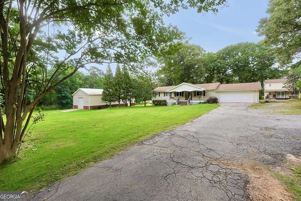 9.37 Acres of Land with Home for Sale in McDonough, Georgia