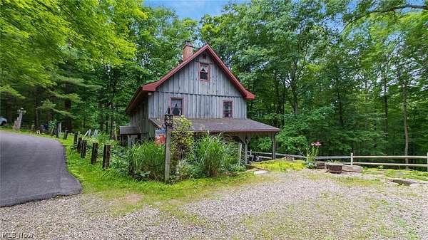 5.59 Acres of Land with Home for Sale in Kimbolton, Ohio
