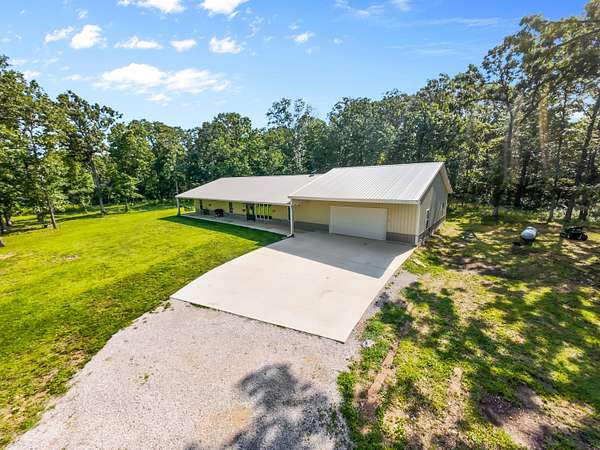 20.2 Acres of Recreational Land with Home for Sale in Halfway, Missouri