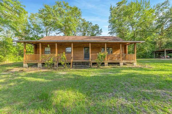 21.8 Acres of Recreational Land with Home for Sale in Quincy, Florida