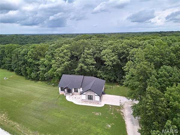 5.6 Acres of Land with Home for Sale in Troy, Missouri