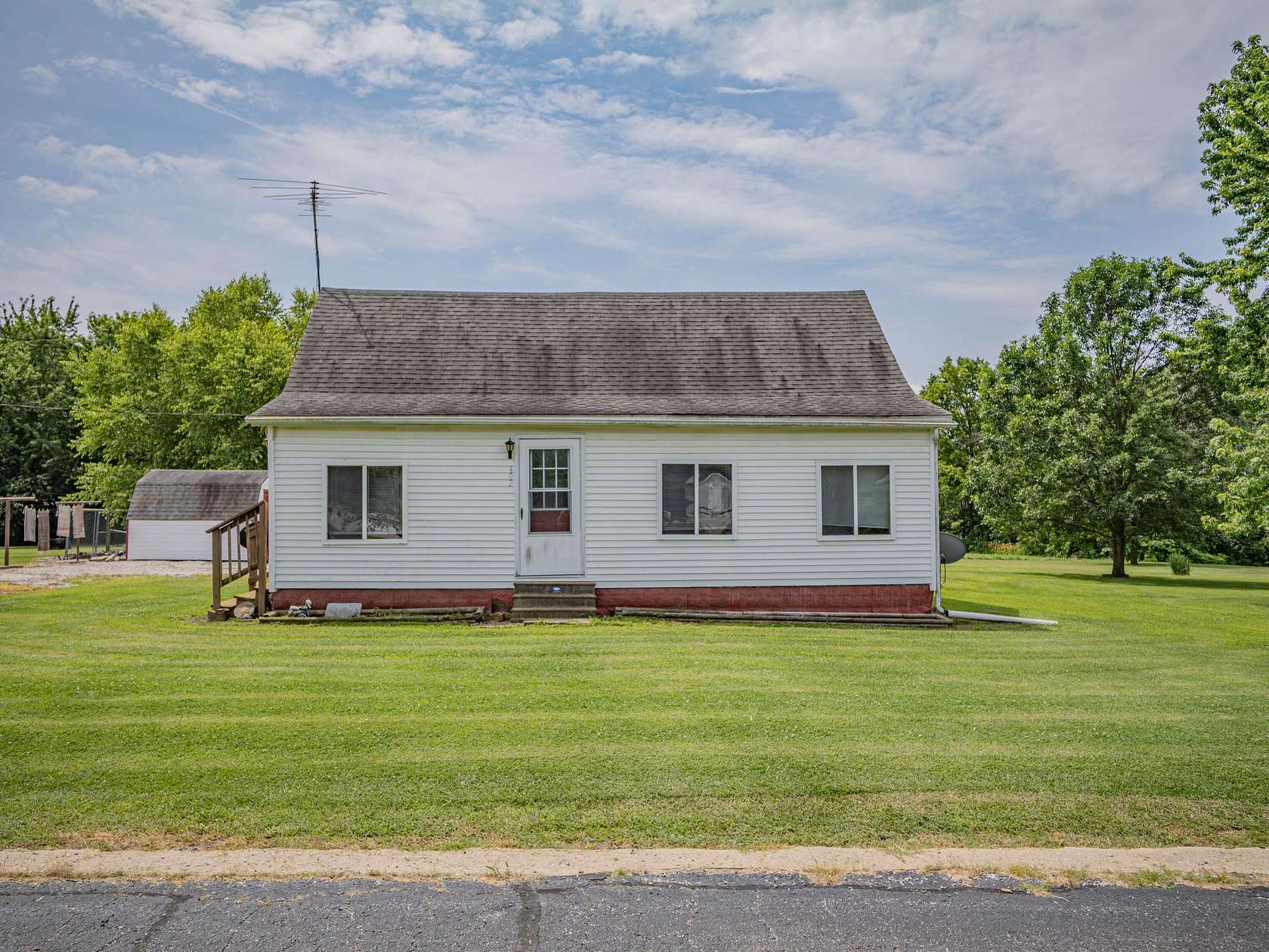 1.55 Acres of Land with Home for Sale in Holliday, Missouri