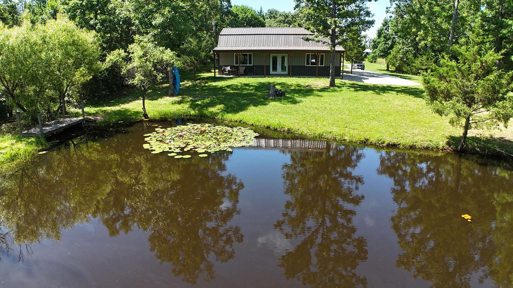 10.6 Acres of Recreational Land with Home for Sale in Louisburg, Missouri