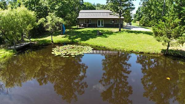 10.6 Acres of Recreational Land with Home for Sale in Louisburg, Missouri