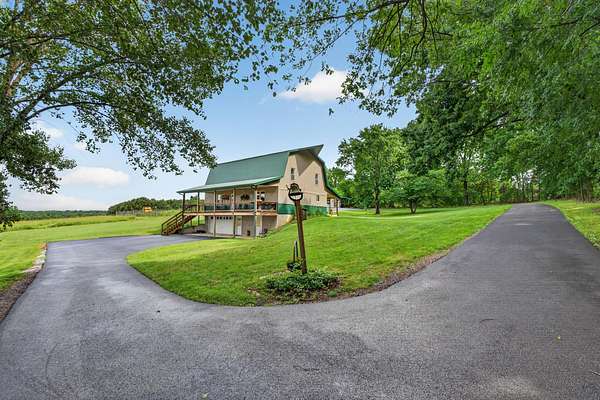 49.3 Acres of Land with Home for Sale in Grand Rivers, Kentucky