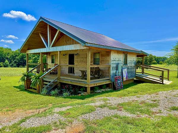 25.8 Acres of Land with Home for Sale in Leoma, Tennessee