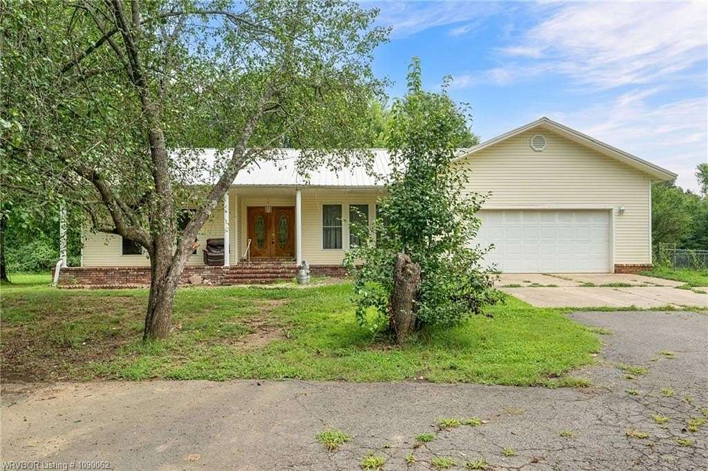 9.7 Acres of Land with Home for Sale in Clarksville, Arkansas