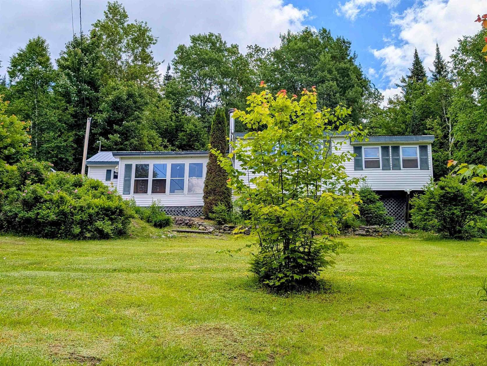 5 Acres of Land with Home for Sale in Stewartstown, New Hampshire