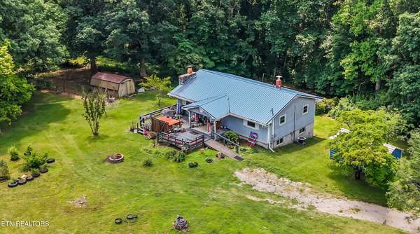 13.1 Acres of Land with Home for Sale in Deer Lodge, Tennessee