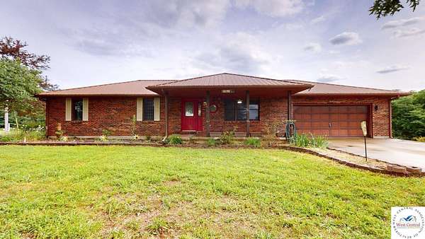 11.2 Acres of Land with Home for Sale in Sedalia, Missouri