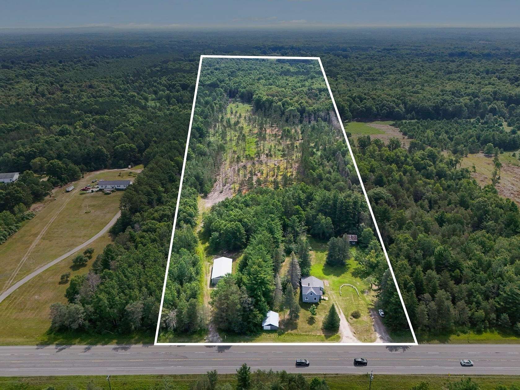 25.1 Acres of Land with Home for Sale in Free Soil, Michigan