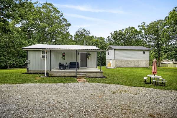 4.9 Acres of Land with Home for Sale in Crab Orchard, Tennessee