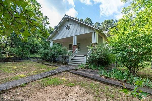 4.75 Acres of Land with Home for Sale in Paris, Arkansas