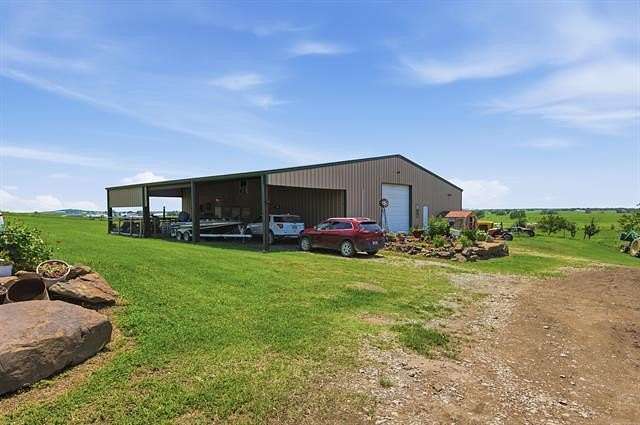 80 Acres of Agricultural Land with Home for Sale in Chouteau, Oklahoma