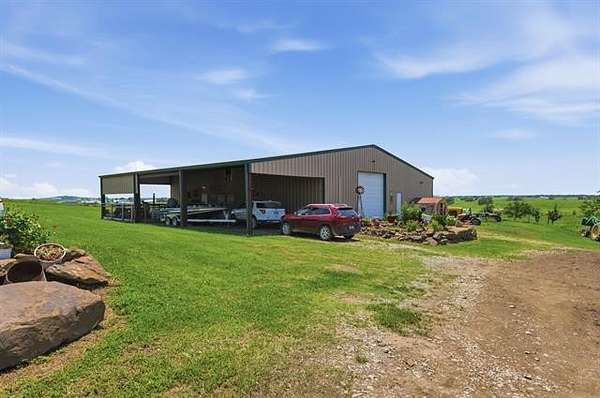 80 Acres of Agricultural Land with Home for Sale in Chouteau, Oklahoma