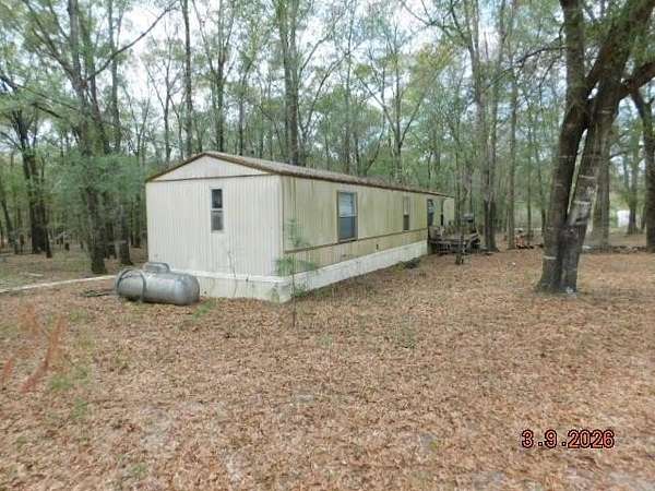 84.4 Acres of Land with Home for Sale in Coleman, Georgia