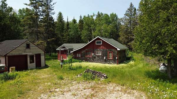 10 Acres of Recreational Land with Home for Sale in Gould City, Michigan