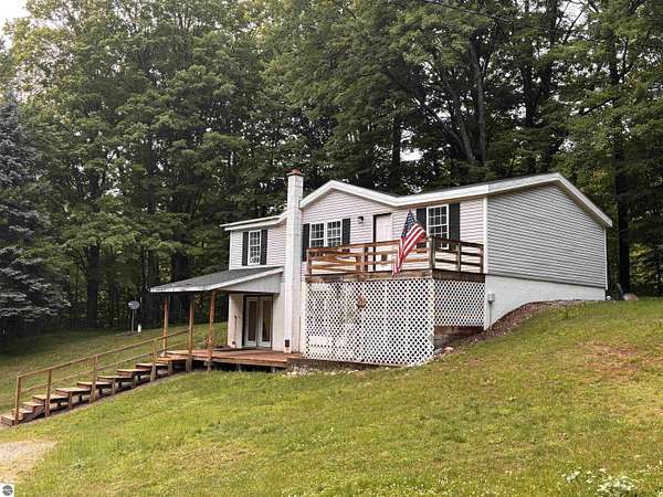 2.47 Acres of Land with Home for Sale in Honor, Michigan