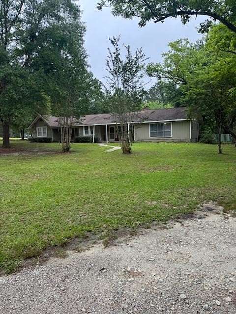 5.85 Acres of Land with Home for Sale in Corrigan, Texas