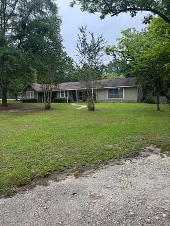 5.85 Acres of Land with Home for Sale in Corrigan, Texas