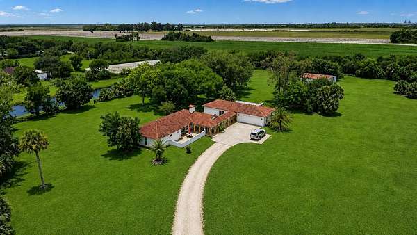 5 Acres of Land with Home for Sale in Loxahatchee Groves, Florida