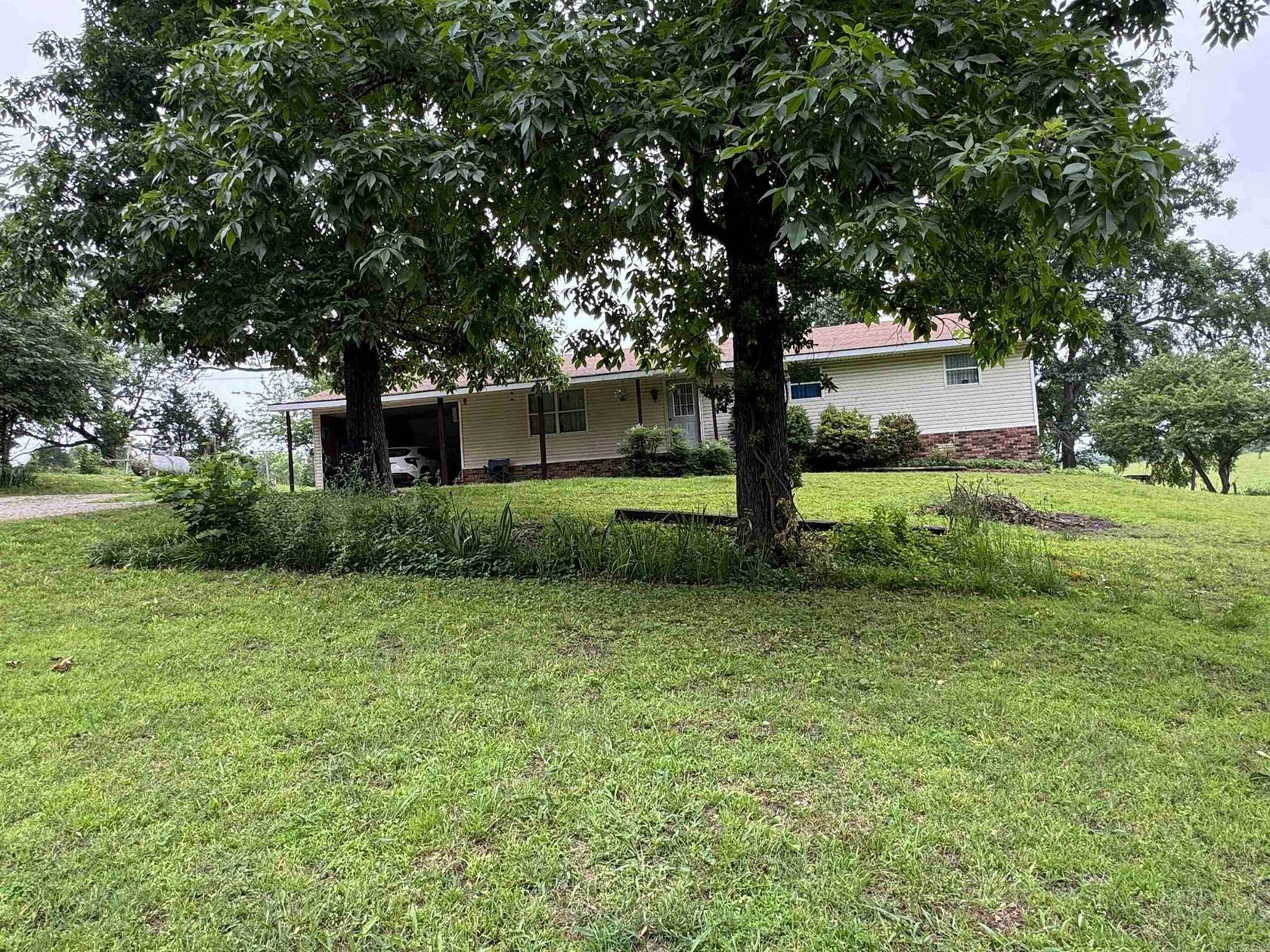 6.5 Acres of Land with Home for Sale in Piggott, Arkansas