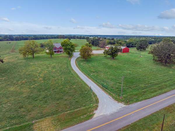 148 Acres of Recreational Land with Home for Sale in Wheatland, Missouri