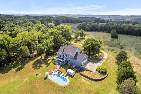 132 Acres of Land with Home for Sale in Kissee Mills, Missouri