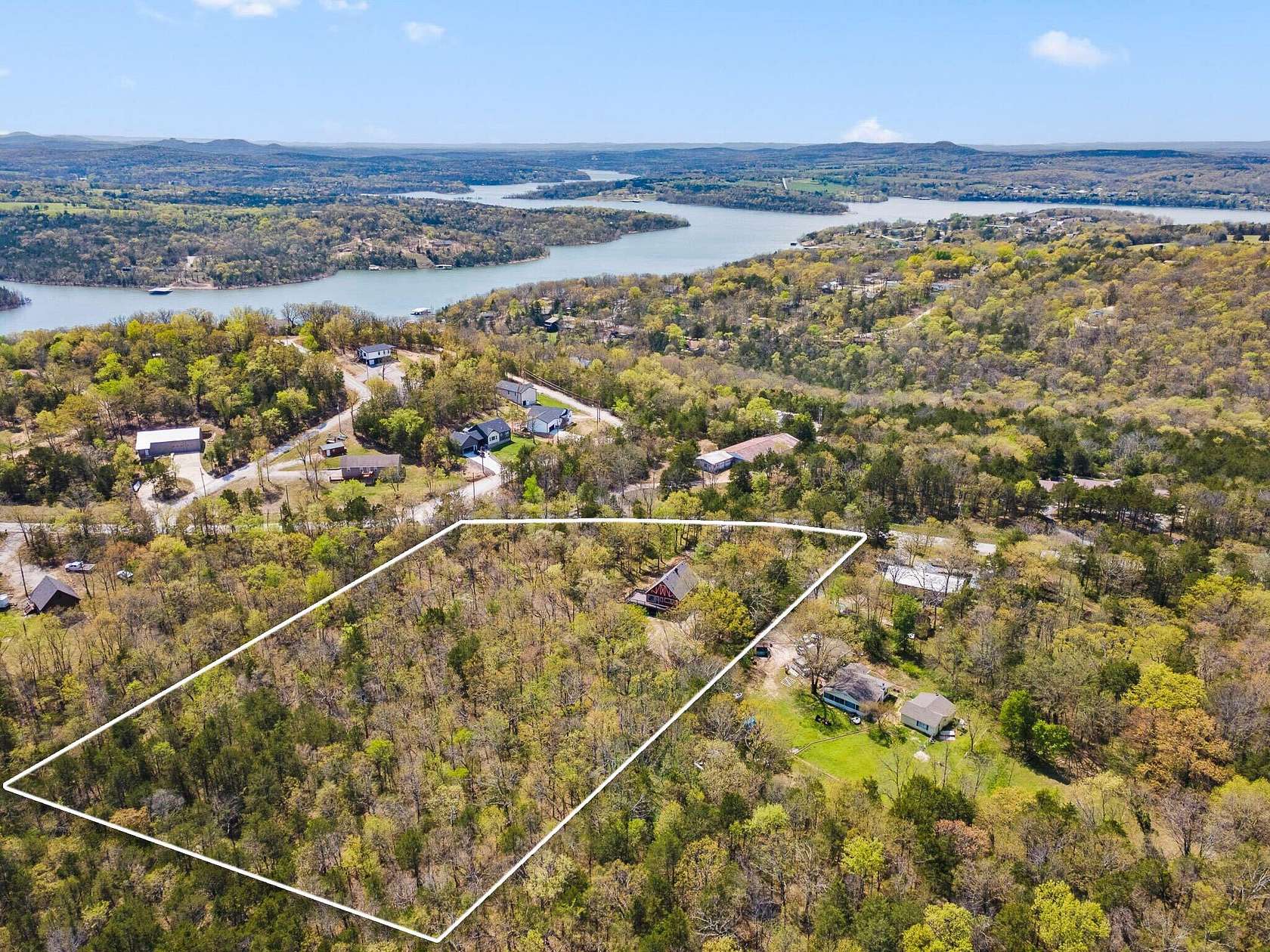 2.79 Acres of Land with Home for Sale in Lampe, Missouri