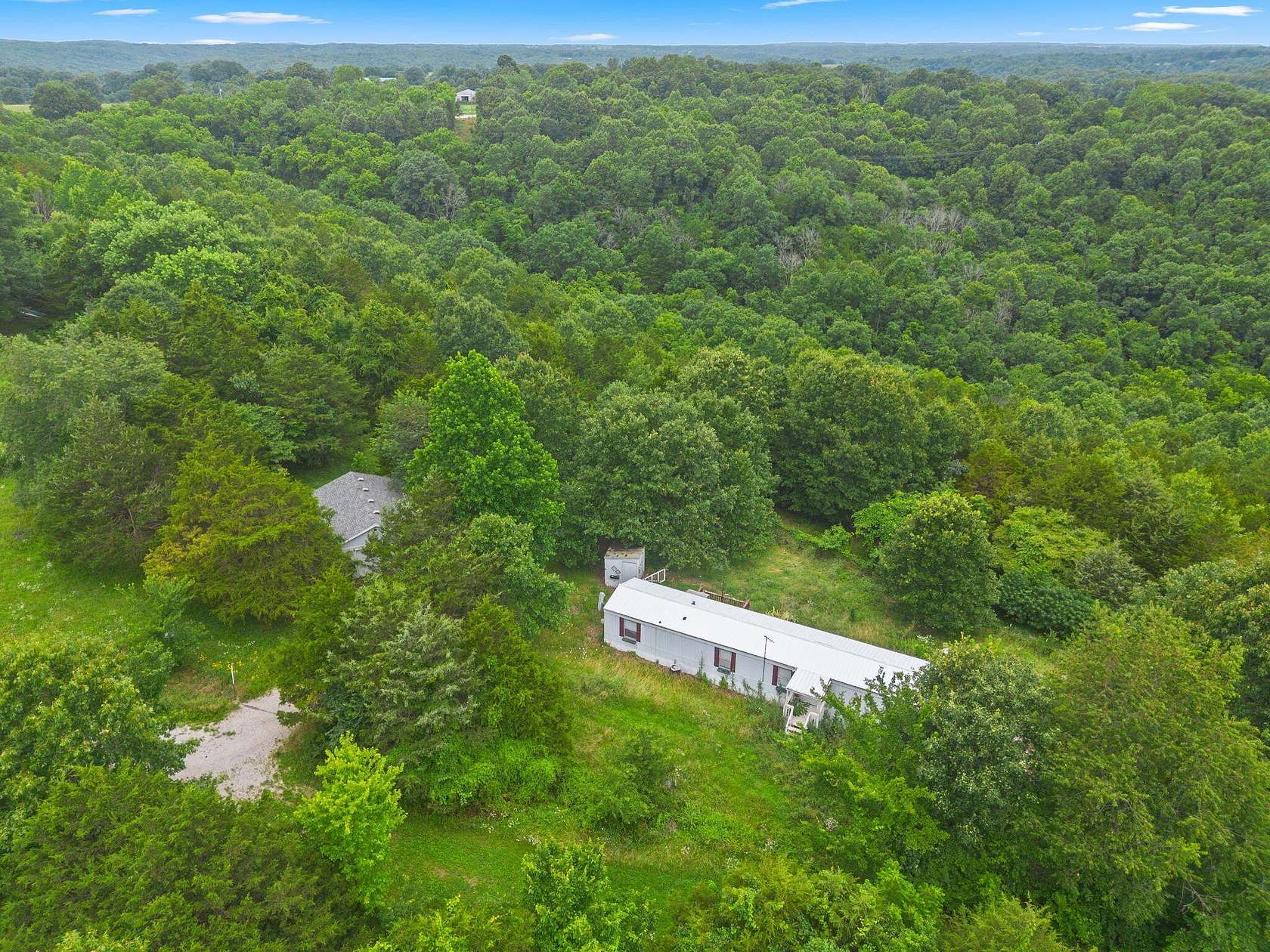 7.4 Acres of Land with Home for Sale in Galena, Missouri