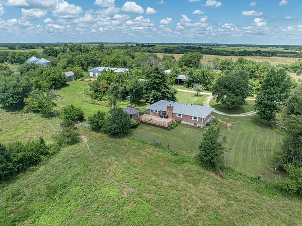 280 Acres of Agricultural Land with Home for Sale in Lockwood, Missouri