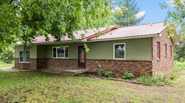 16.1 Acres of Land with Home for Sale in Exeter, Missouri