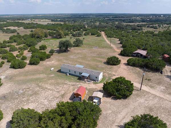 16.3 Acres of Land with Home for Sale in Bertram, Texas