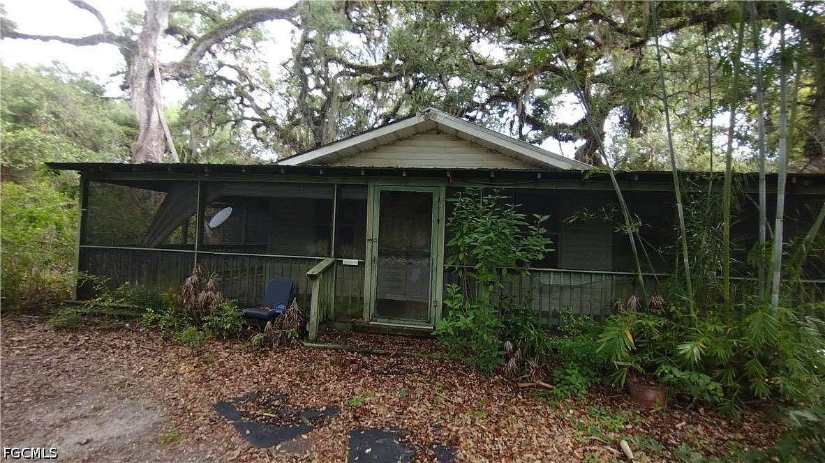 5.35 Acres of Land with Home for Sale in Moore Haven, Florida
