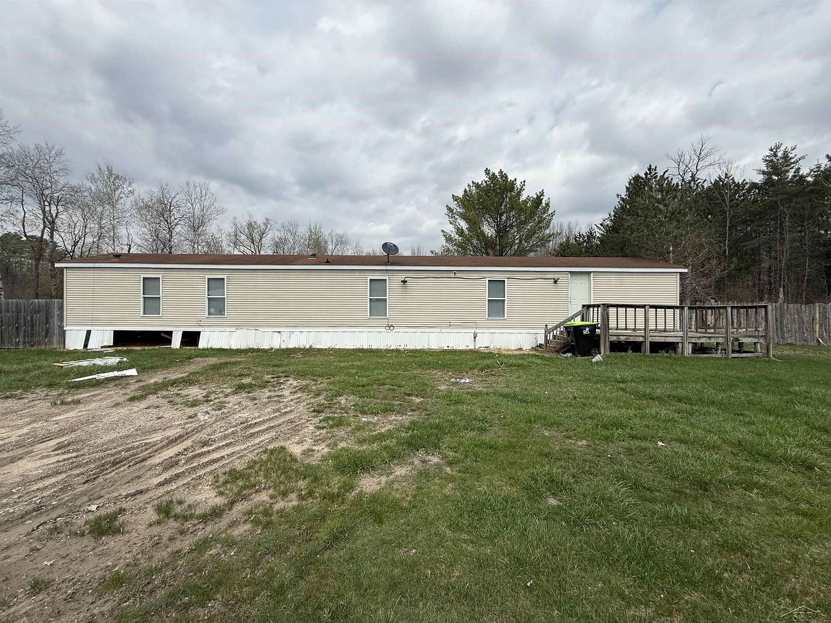1.5 Acres of Land with Home for Sale in Rhodes, Michigan