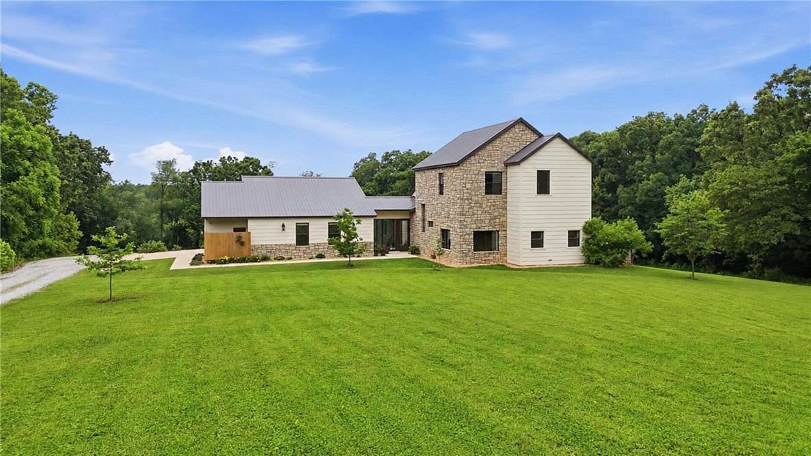 4.55 Acres of Land with Home for Sale in Highfill, Arkansas