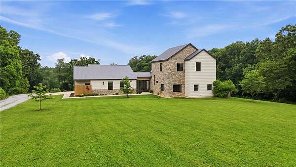 4.55 Acres of Land with Home for Sale in Highfill, Arkansas