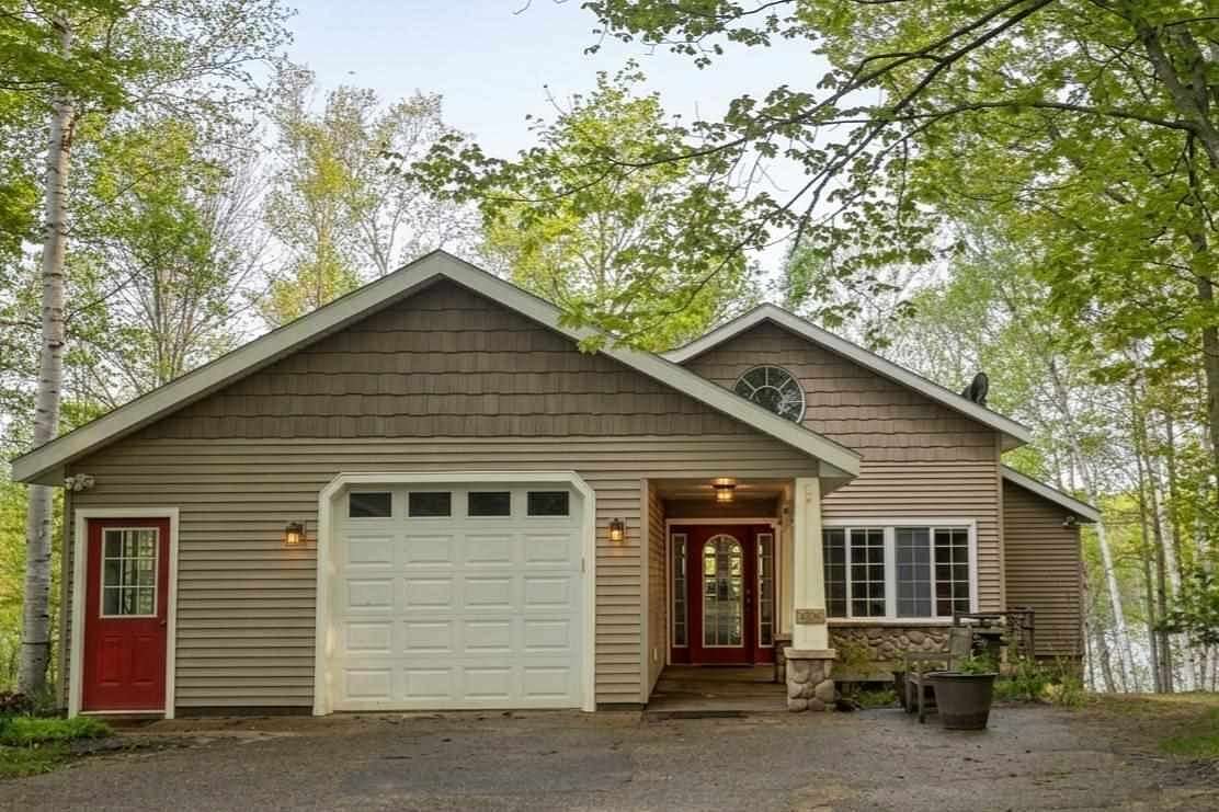 4 Acres of Land with Home for Sale in Charlevoix, Michigan