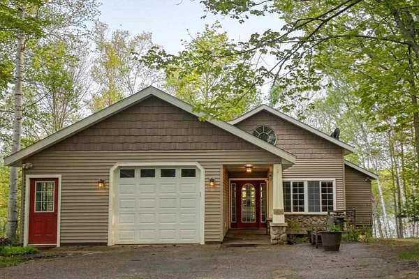 4 Acres of Land with Home for Sale in Charlevoix, Michigan