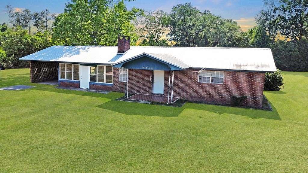 1.56 Acres of Land with Home for Sale in Wewahitchka, Florida