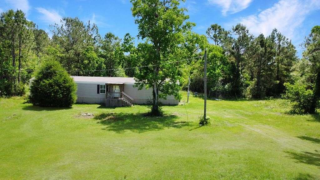 5 Acres of Land with Home for Sale in Wewahitchka, Florida