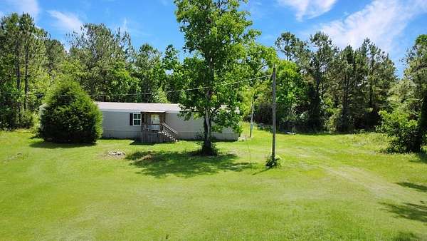 5 Acres of Land with Home for Sale in Wewahitchka, Florida
