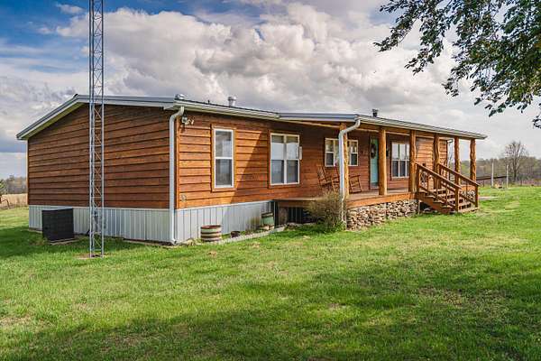 165 Acres of Land with Home for Sale in Caulfield, Missouri
