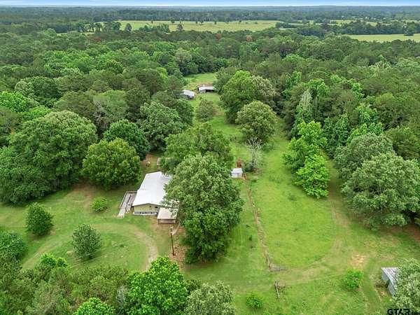 22.5 Acres of Land with Home for Sale in Carthage, Texas