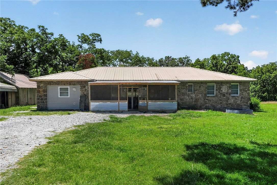 14.6 Acres of Land with Home for Sale in Garfield, Arkansas