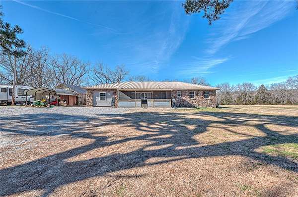 14.6 Acres of Land with Home for Sale in Garfield, Arkansas