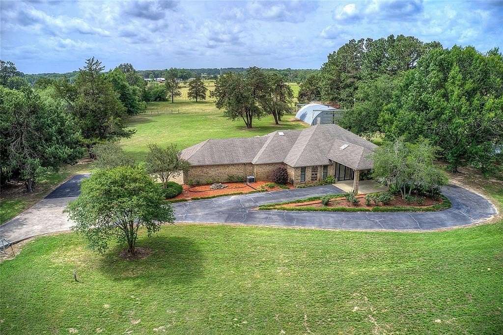 8.23 Acres of Land with Home for Sale in Quitman, Texas