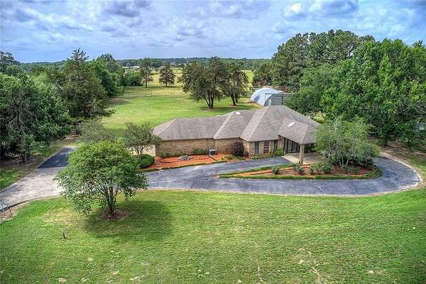 8.23 Acres of Land with Home for Sale in Quitman, Texas