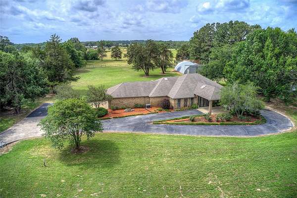 8.23 Acres of Land with Home for Sale in Quitman, Texas