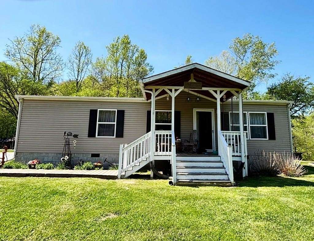31.9 Acres of Recreational Land with Home for Sale in Louisa, Kentucky